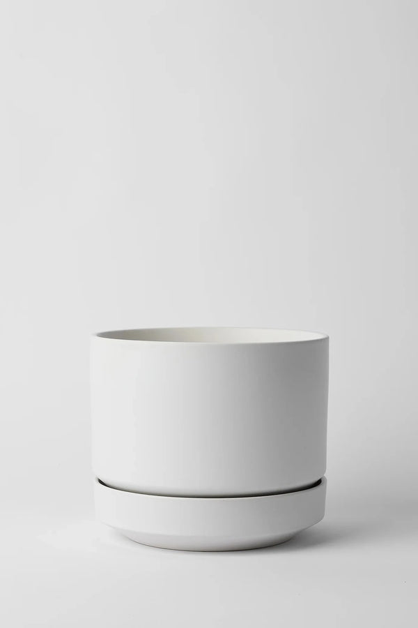 LBE Design Revival Ceramics White Round Two planter against a white wall empty.