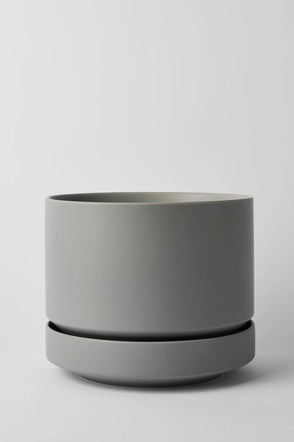 LBE Design Round Pot & Saucer Gray empty and against a light grey backdrop. 