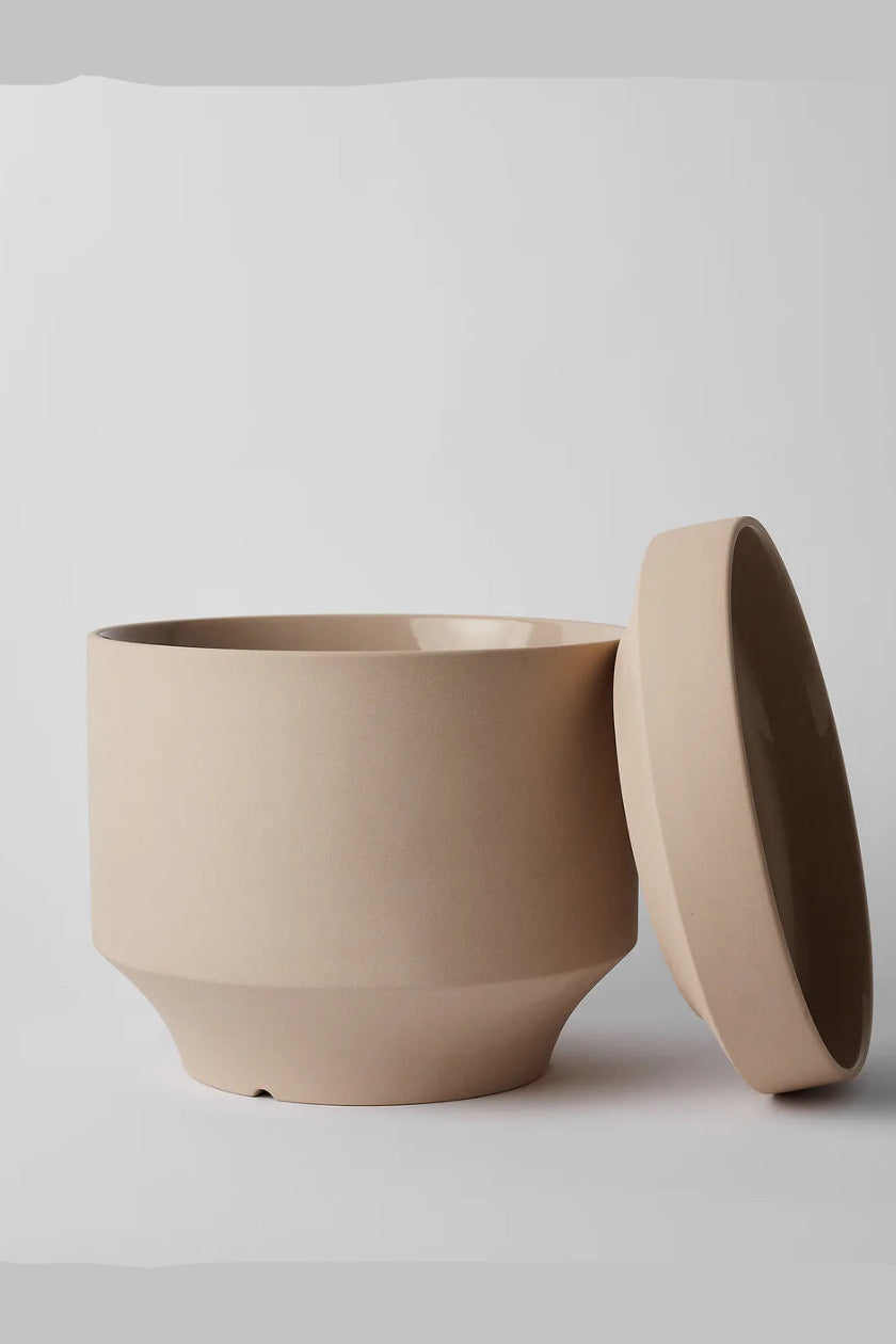 Oatmeal Round Two ceramic pot with a saucer on a light gray background ©Revival Ceramics