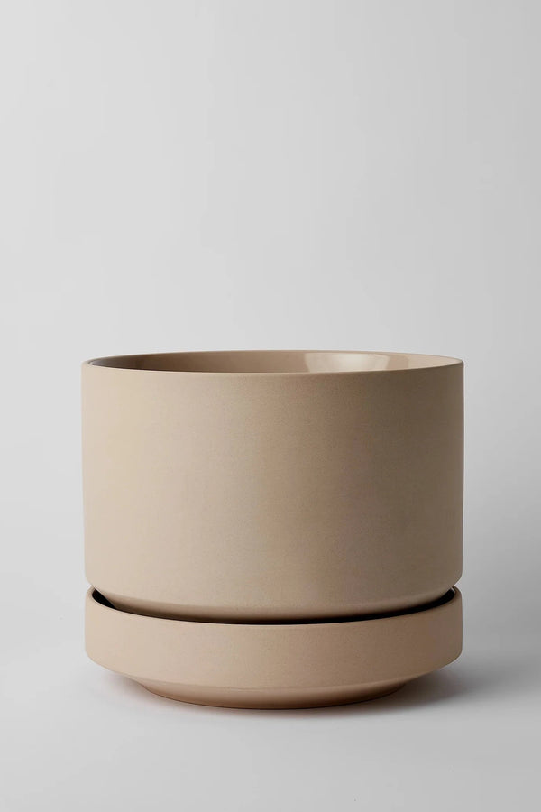 LBE Design Oatmeal Round Two Planter empty and against a light grey wall. 