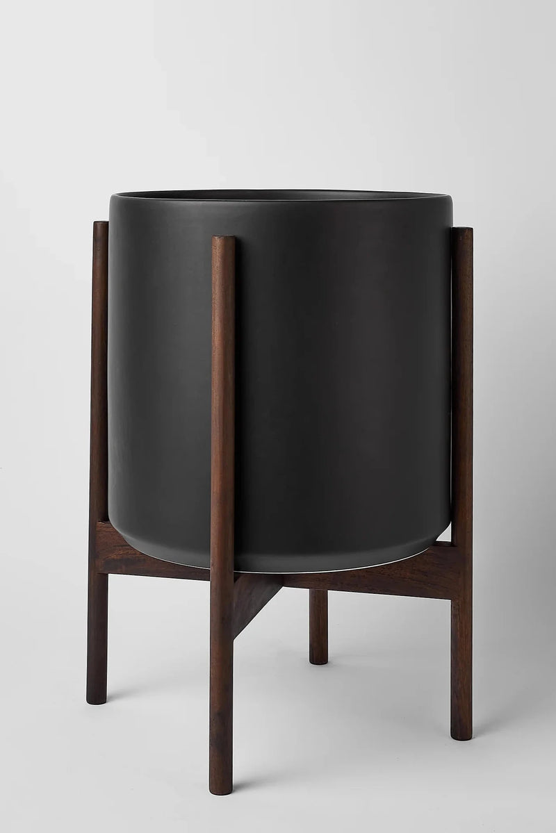 the 12 black cylinder and dark teak stands by LBE Design