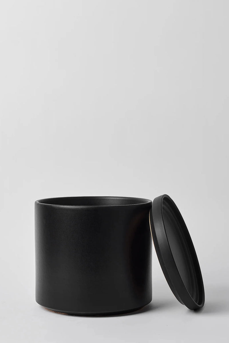 Solid Goods Solid Cylinder and Saucer Black by LBE Designs showing the saucers leaning against the main pot