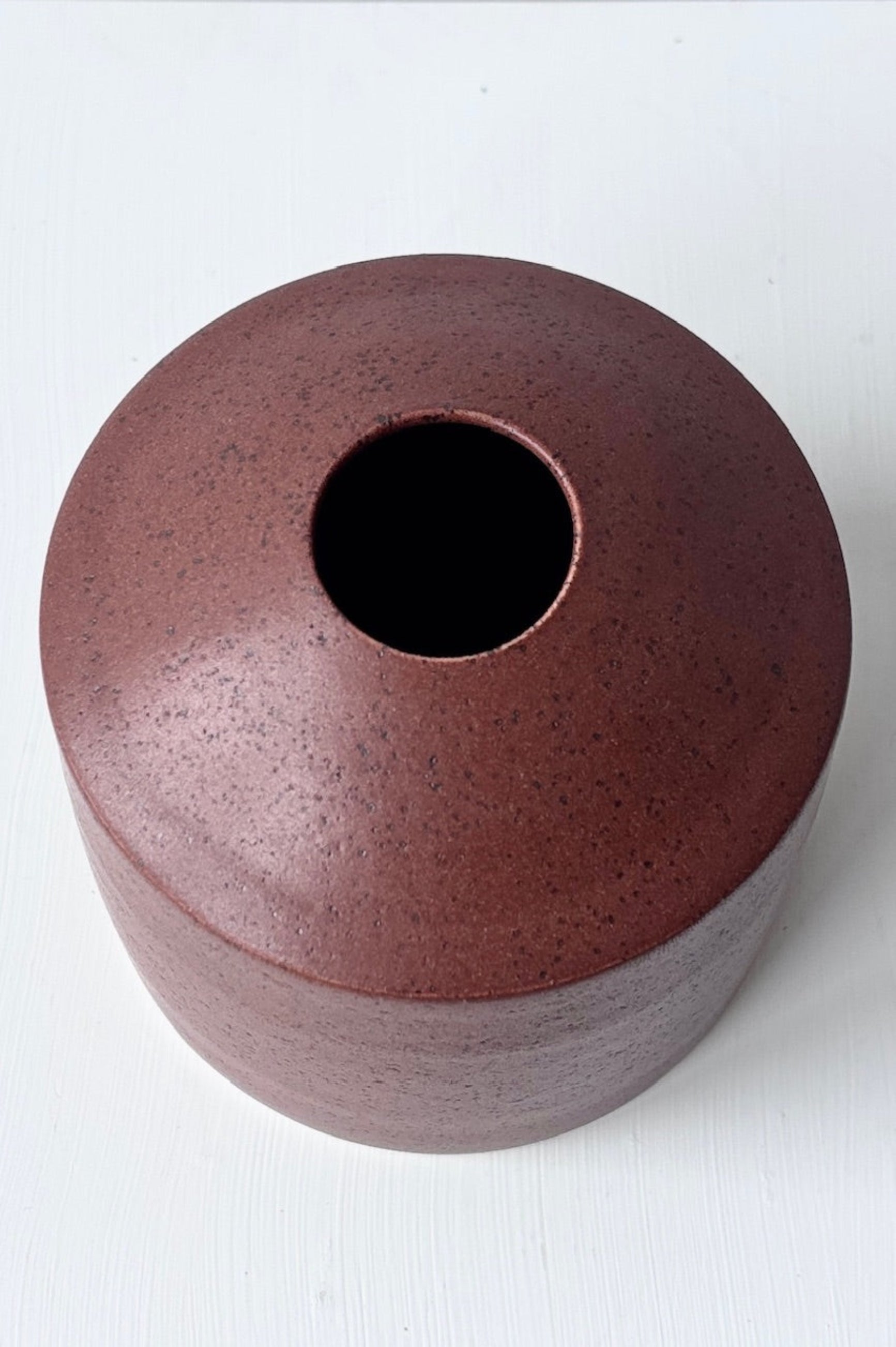 Top view of chocolate speckled siros vase against a white background ©Sprout Home 