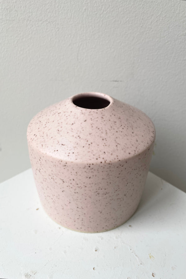 the Pink Speckle siros vase shown from above and side showing the diameter of the opening. 