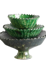 Stacked various sized compote green Tamegroute bowl on white backdrop.