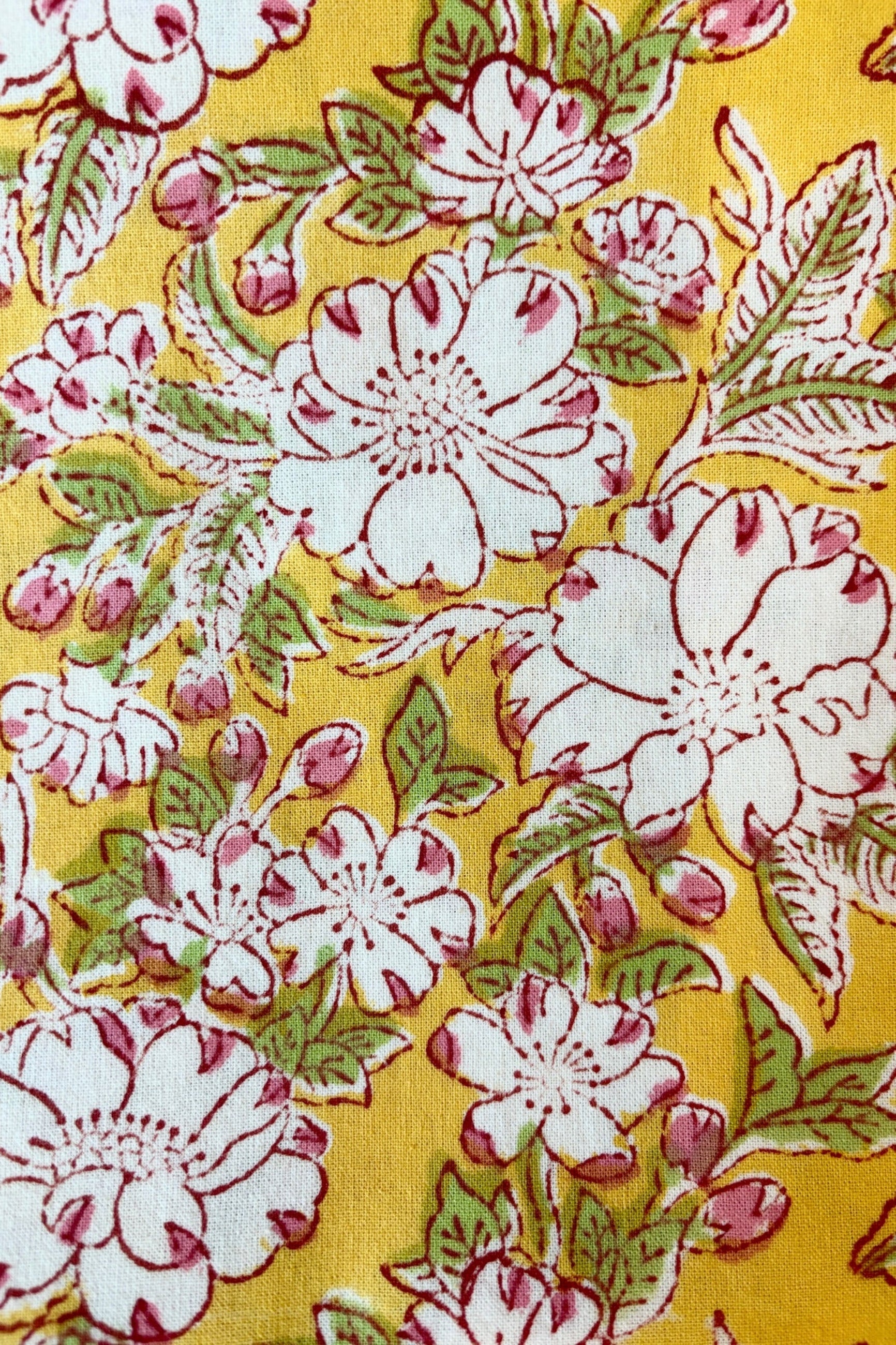 Detail of hand printed, 100% cotton Camelia yellow and pink tablecloth ©Sprout Home