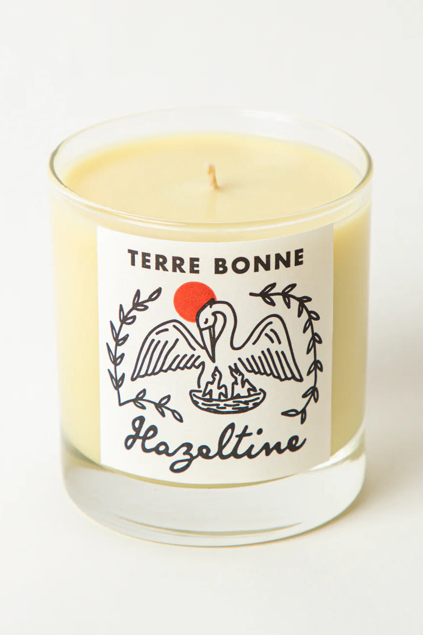 Candle with 'Terre Bonne' label on a white background ©Hazeltine