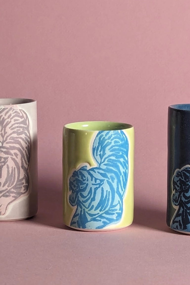 Ceramic cups with a tiger patterns on a pink background ©City in Bloom Ceramics