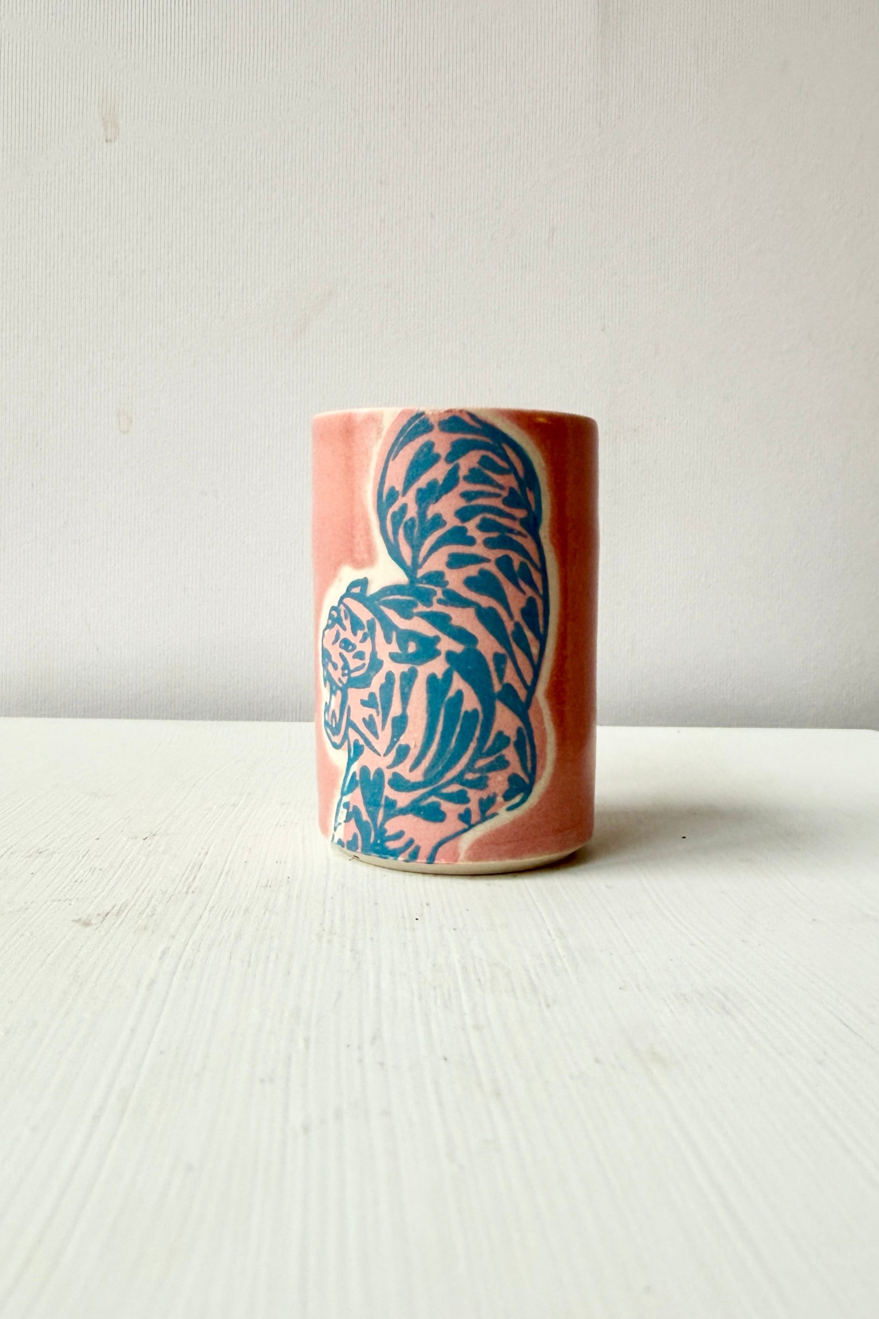 Ceramic vase with blue tiger design on a white background ©Sprout Home