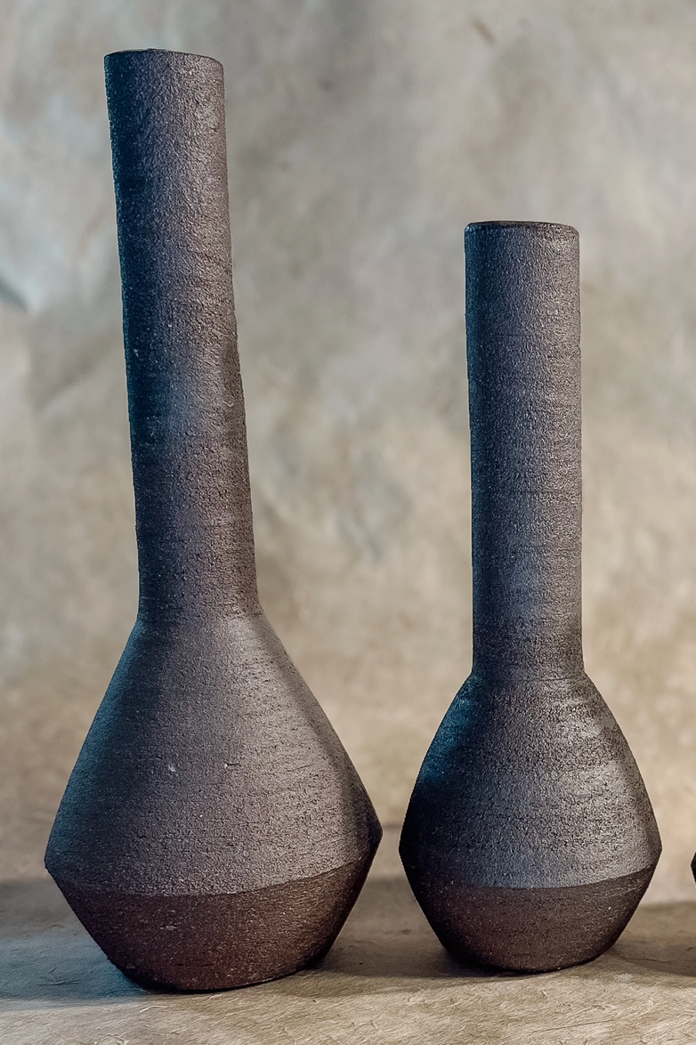 Tall ceramic bud vases against a neutral background ©Olivia Snow Ceramics