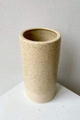 Jacqueline vase in Butter Speckle shown from the side top looking in. 