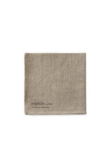 Natural Linen Napkin folded in to a square and viewed from the front top on a white backdrop by Fog Linen Work.