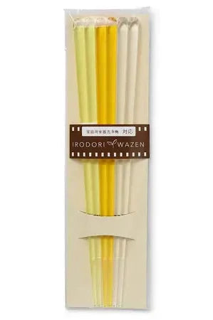 The set of three Yellow gradient acrylic chopstick and their packaging. 