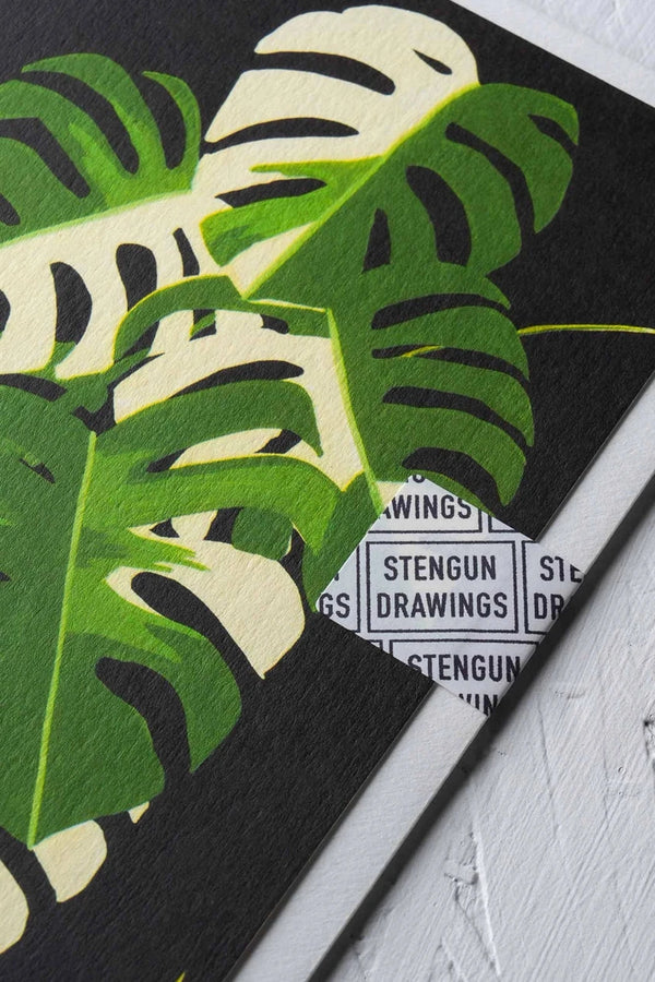 Variegated Monstera greeting card by Stengun Drawings detail of the town toned leaves on black in the upper right corner. 