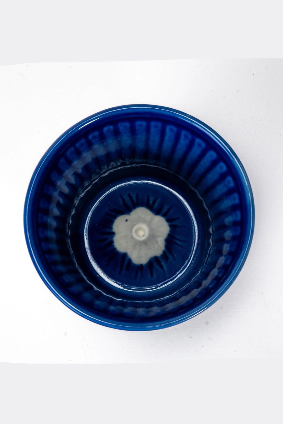 Blue ceramic Fuji Sakura cup with textured design on a white background  ©Urban Tokyo