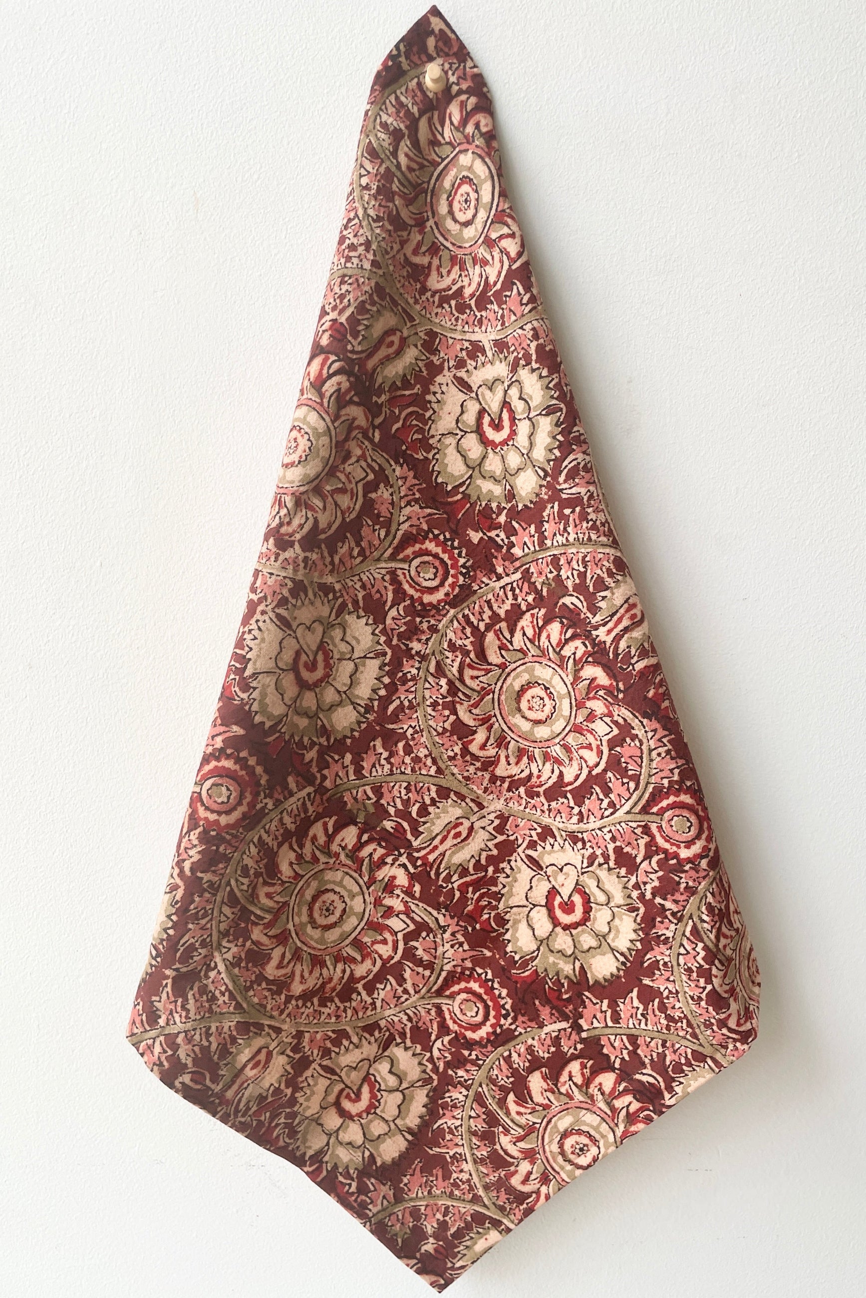 The Adah napkin lela hanging in front of a white wall.   ©Sprout Home