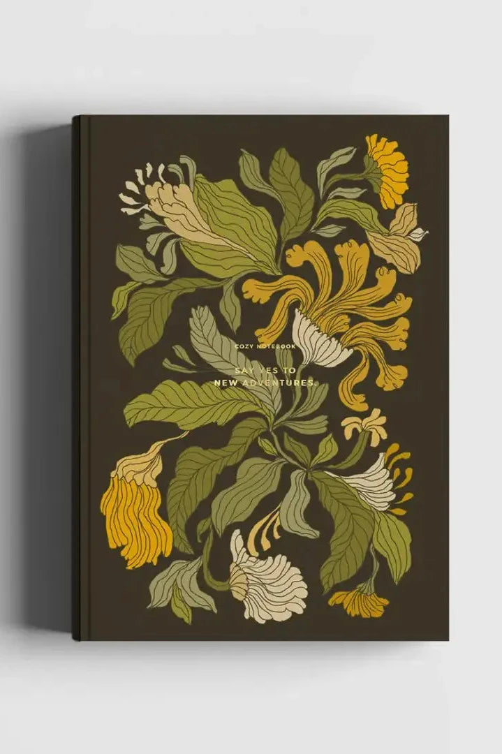 The Floral Sweet Pea Notebook shown from the front with its green and yellow floral on black, 