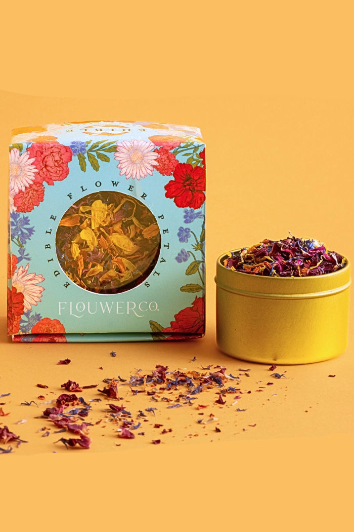 Flower petal packaging with a yellow container of petals on an orange background ©Flouwer Co.