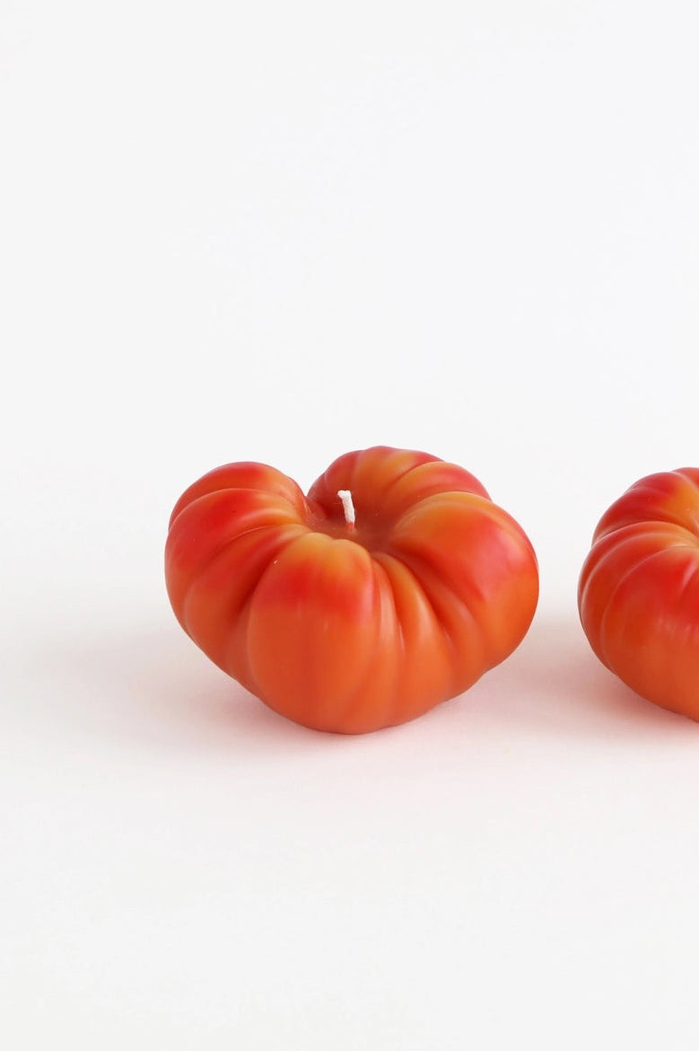 Two red tomatoes tomato candles on a white background ©Artifaqt