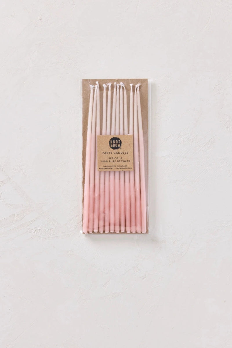 Knot & Bow Tall Ombre Pink beeswax candles in its packaging.