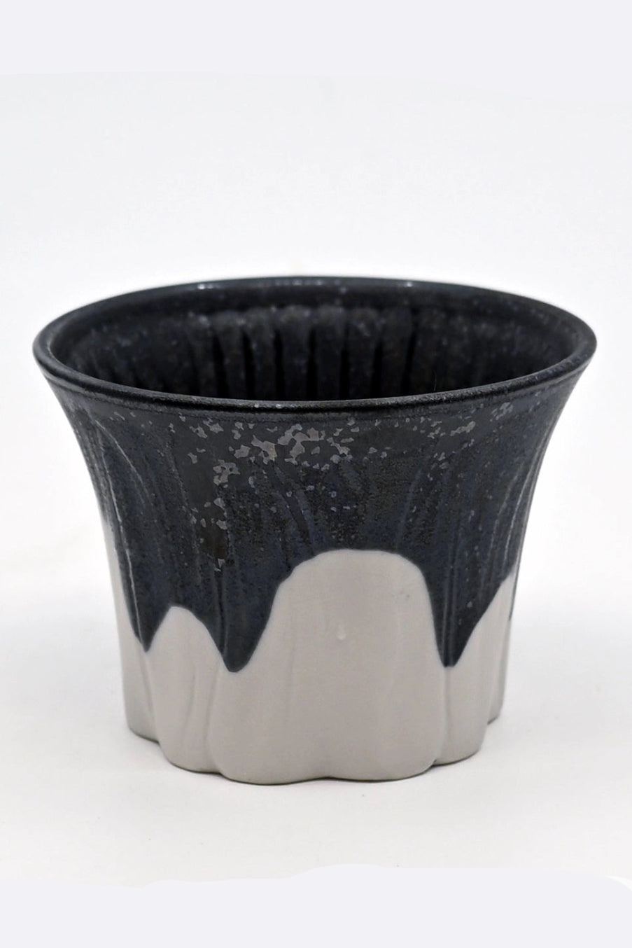 Ceramic Fuji Sakura cup with black top and white bottom on a white background  ©Urban Tokyo
