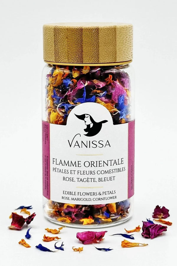 Vanissa Flamme Orientale edible flowers in its packaging and loose petals in front of it. 