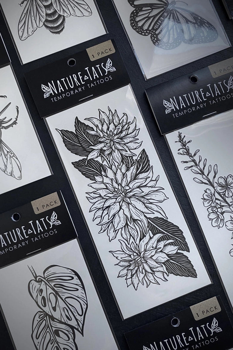 Nature-Inspired Temporary Tattoo packages with floral and insect designs. ©Nature Tats
