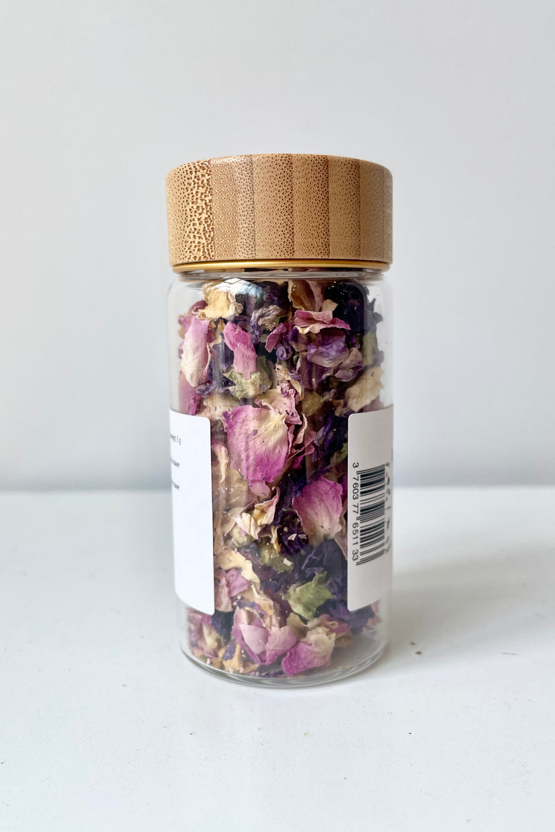 glass jar of Boreal Edible Flower Petals viewed from the backside 