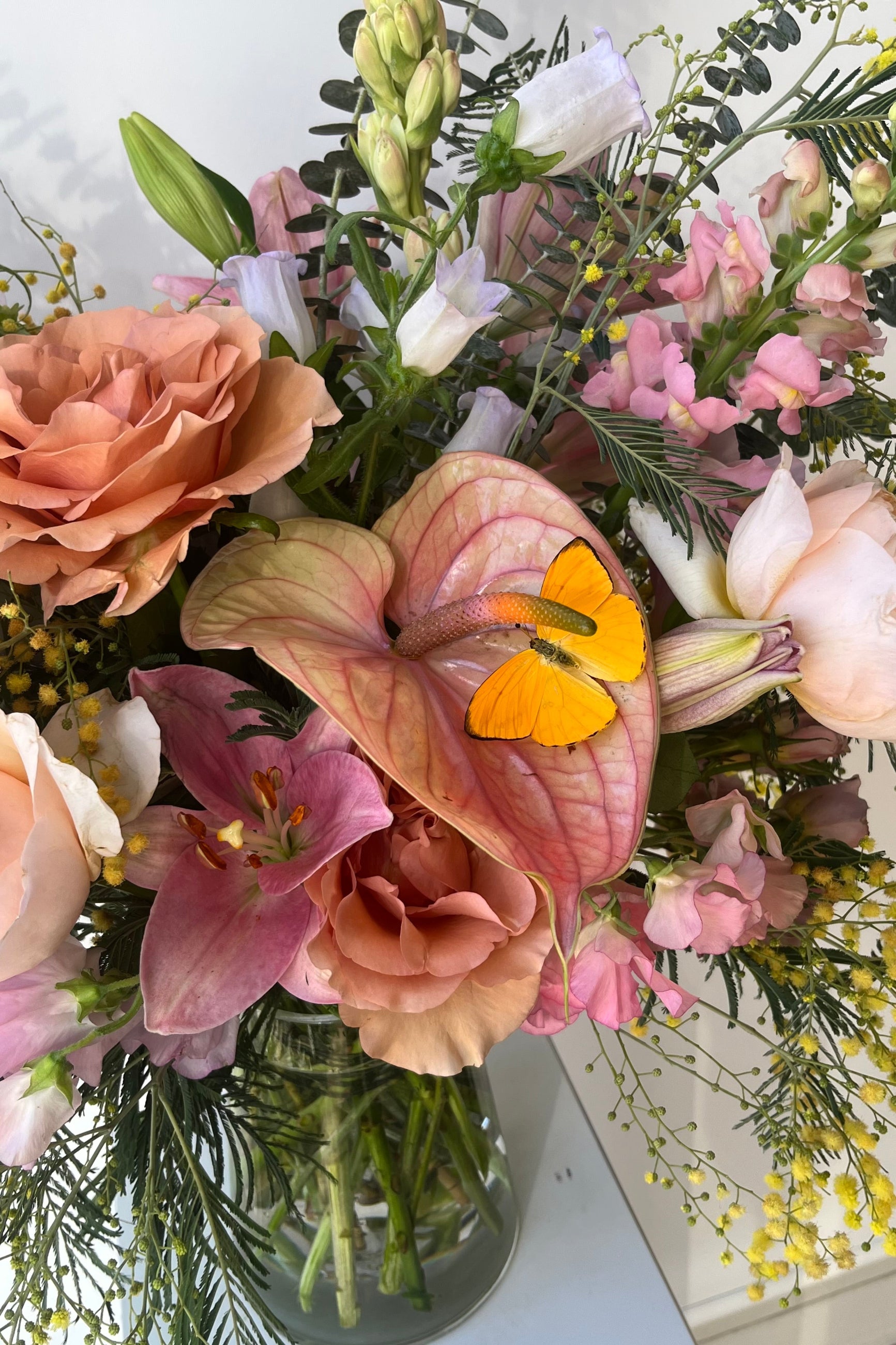 Sprout Home custom floral arrangement with a yellow butterfly on an Anthurium ©Sprout Home #size_$200