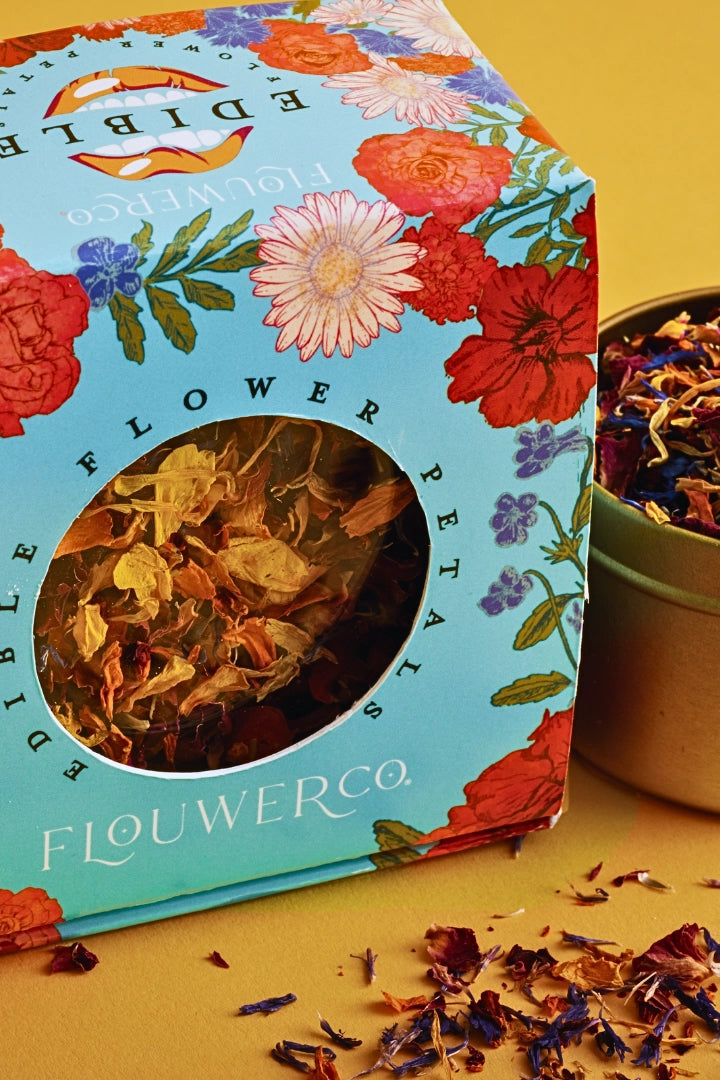 Flower petal packaging with a small container of petals on a yellow background ©Flouwer Co.