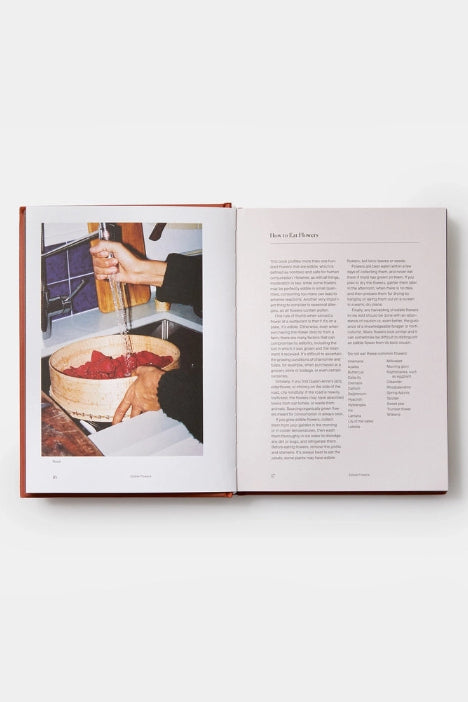 Open Edible Flowers, why and where, book showing a photo of hands washing red vegetables in a sink with text on the right page. ©Phaidon