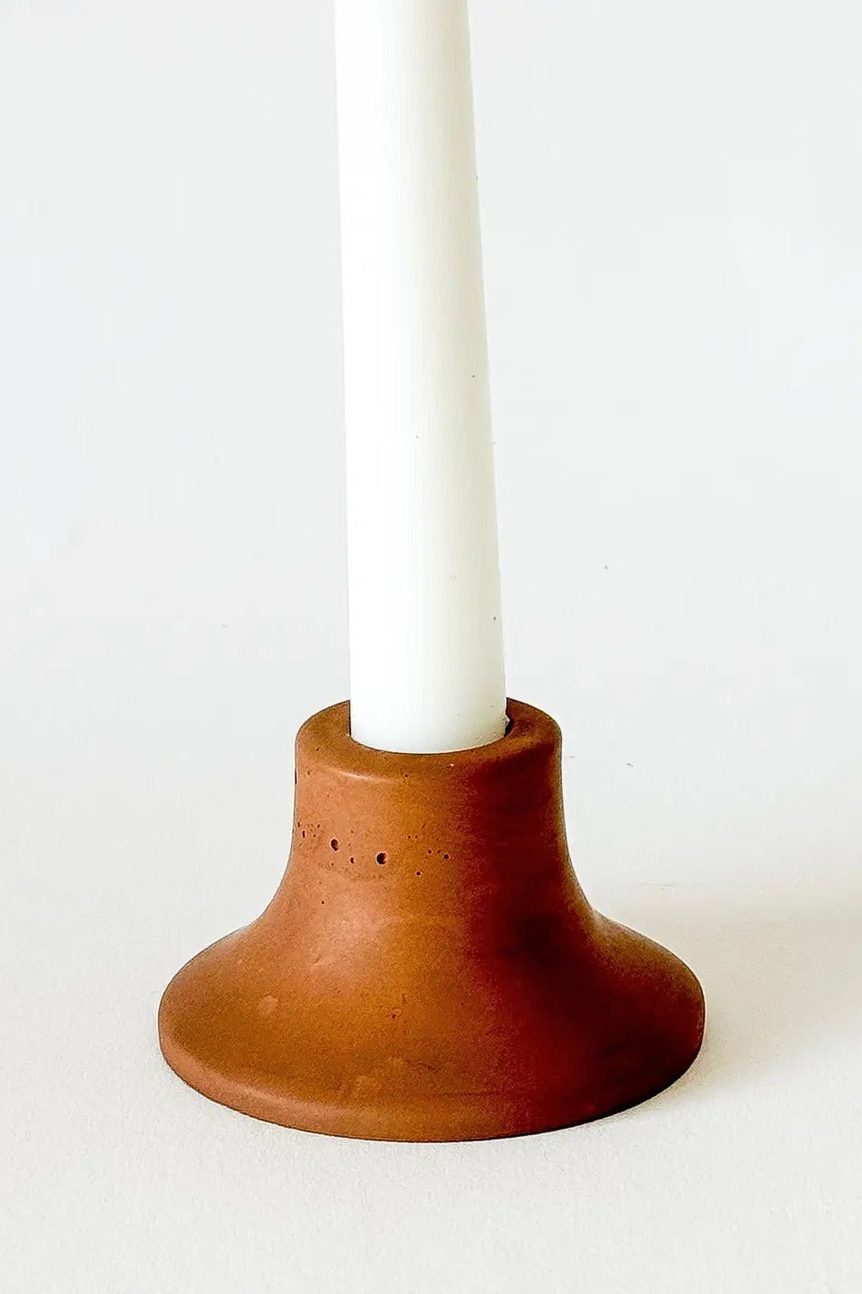 Mina Short Taper Candle Holder Saddle with a white candle ©Sunday Nomad