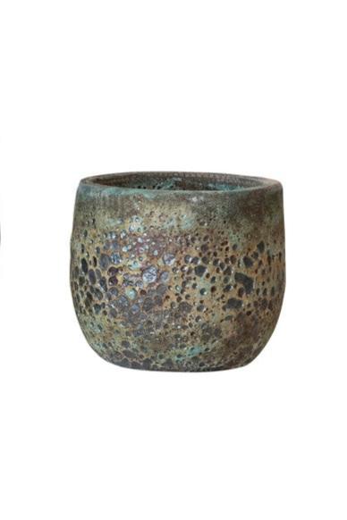 Small volcano pot viewed from the side with its deep patterned texture in shades of brown and blue green..