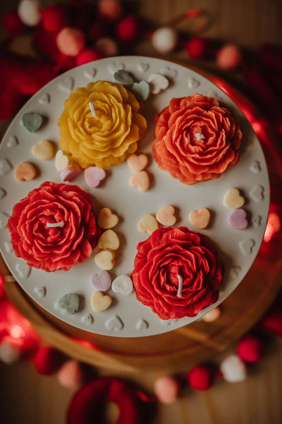 Decorative cake with colorful flower designs on a white base. ©The Holten Homestead