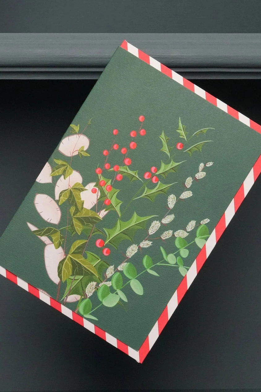 Holiday Stems greeting card by Stengun Drawings with its holiday greens in green, red and white on the front.