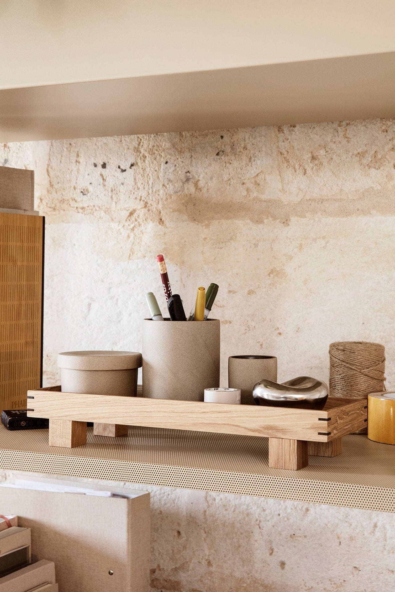 Bon Wooden Tray Oak XS in a lifestyle shot with accoutrements on top of it sitting in a nook  ©Ferm Living