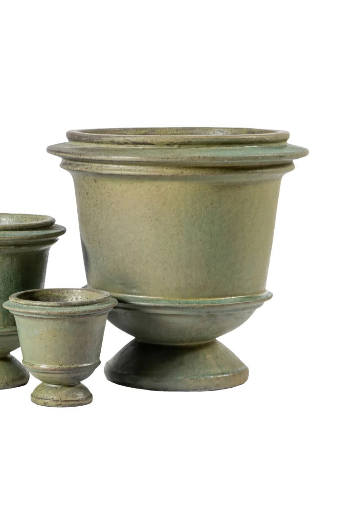 Set of three sage green ceramic Livvy planters of different sizes on a white background ©Anamese
