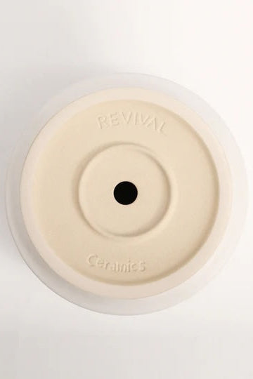 Bottom of a white planter showing the drain hole ©LBE Design