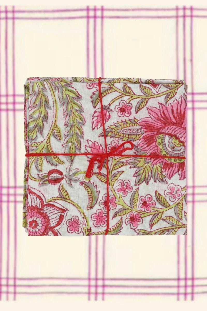 Cotton Napkins Gypsophil Pasteque sitting on a plaid cloth ©Suzette a Table