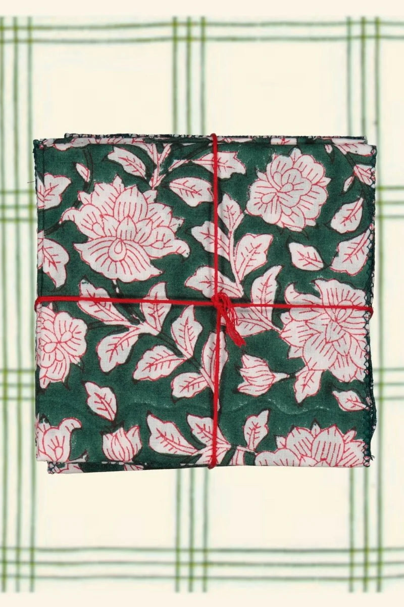 Cotton Napkins Iris Sapin shown folded with a red string ©Suzette a Table