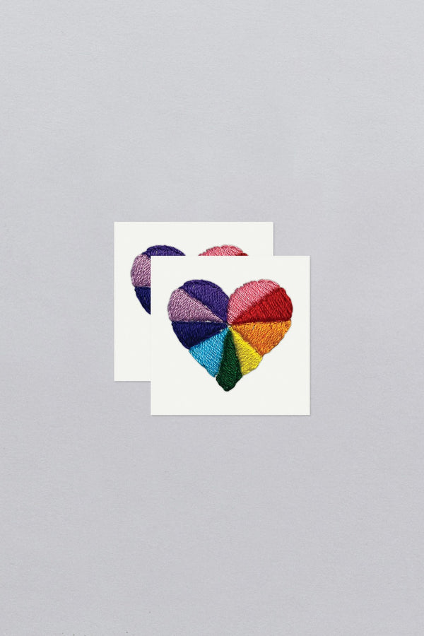 Rainbow Heart Tattoo Pair on their sheets from Tattly. 