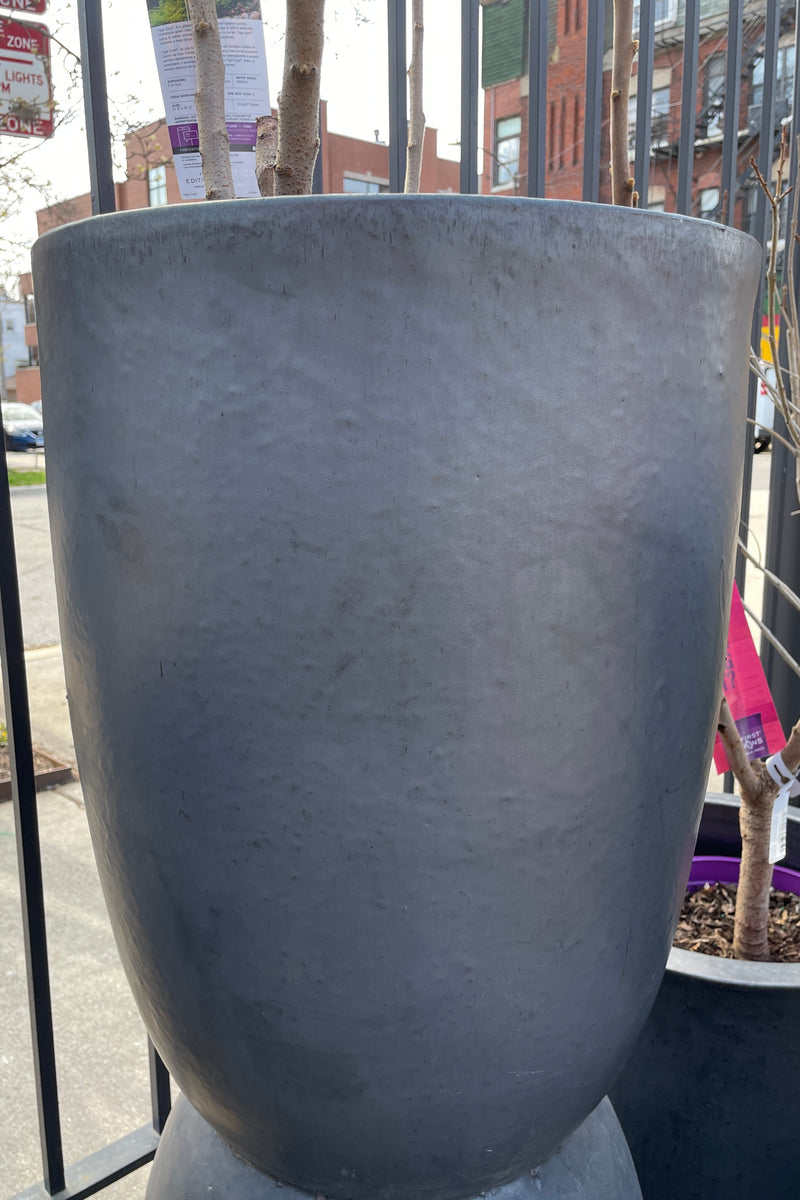 Graphite crucible planter, empty, in the Sprout Home yard ready to be planted. 