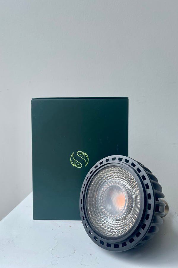 Soltech Solutions Vita grow light bulb in black. Front detail against white wall.