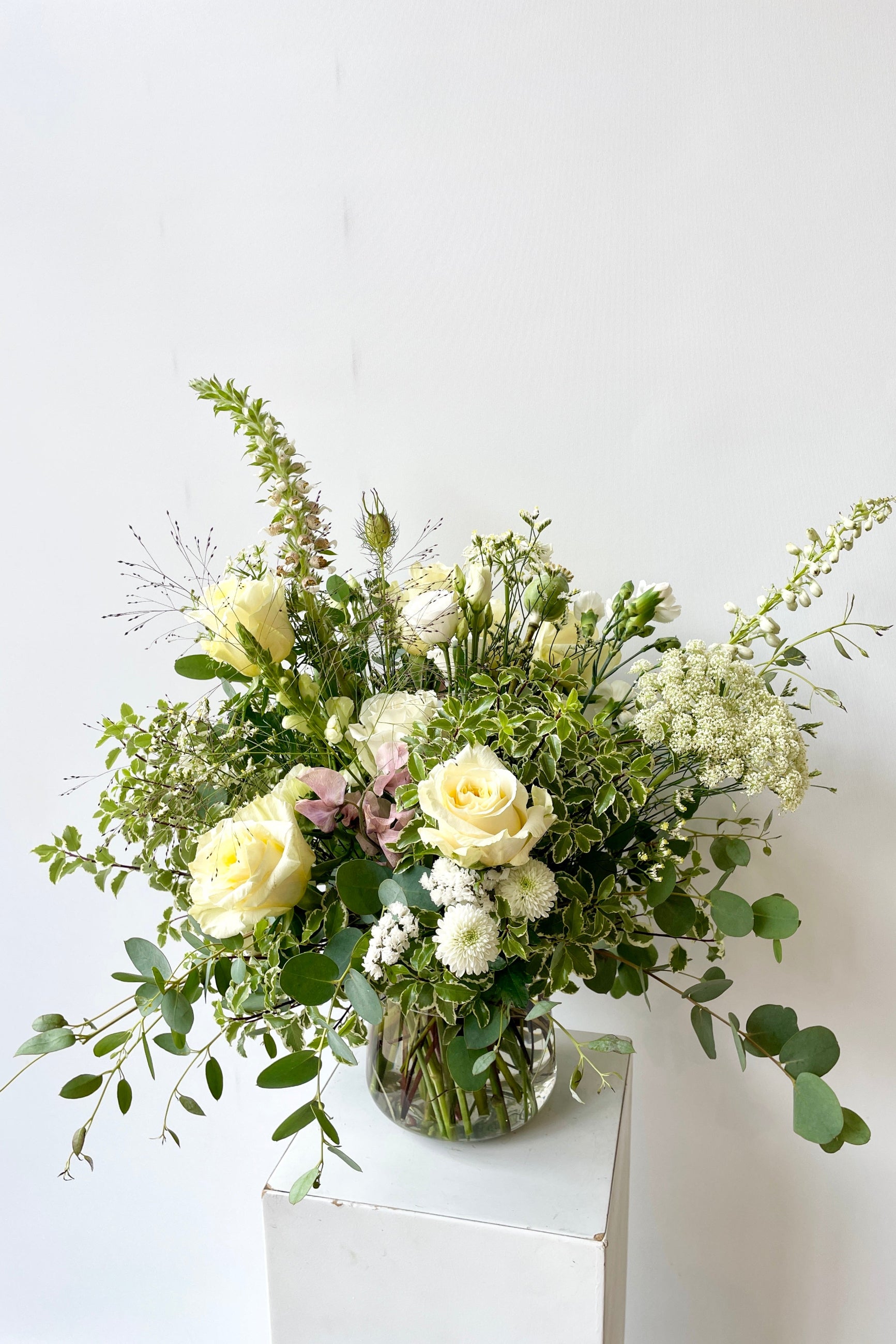 Custom floral white Bleached arrangement by Sprout Home with queen annes lace, roses and local floral. ©Sprout Home #size_$160