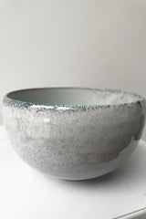 A detailed view of Bowl indigo fog in large against a white backdrop