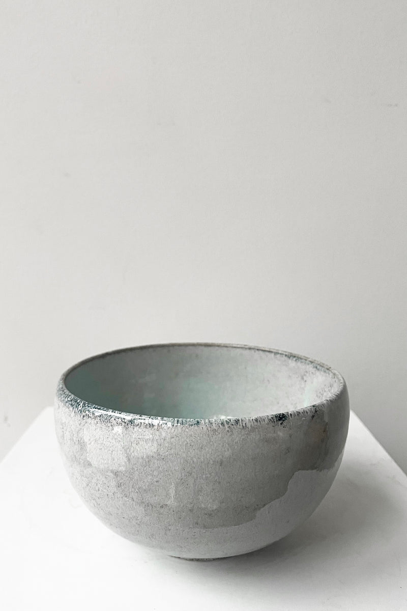 A full view of bowl indigo fog in large against a white backdrop