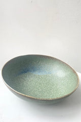 An overhead view of Bowl terra green large against white backdrop
