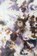 A detailed view of the pattern of Marble Tablecloth plum 
