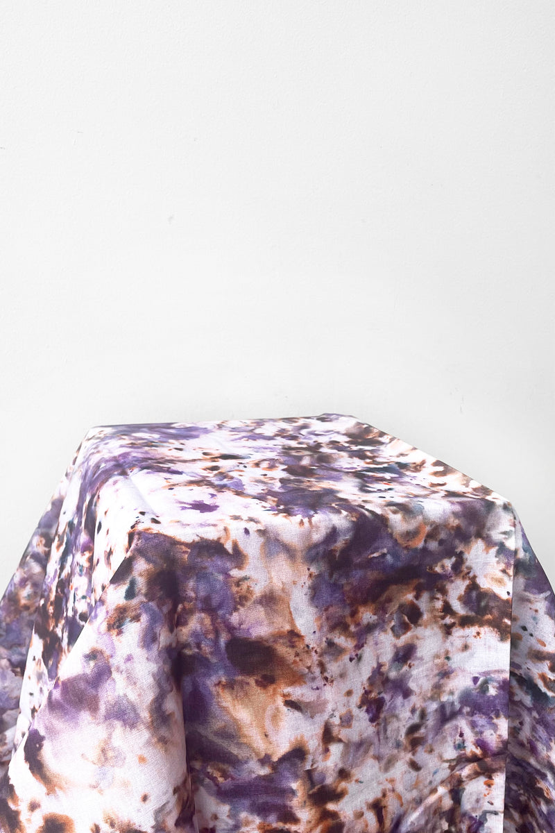 A full view of displayed Marble Tablecloth plum against a white backdrop