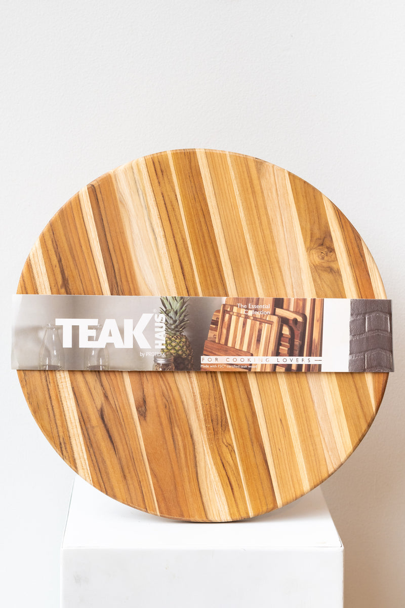 Teakhaus round medium cutting board against a white background